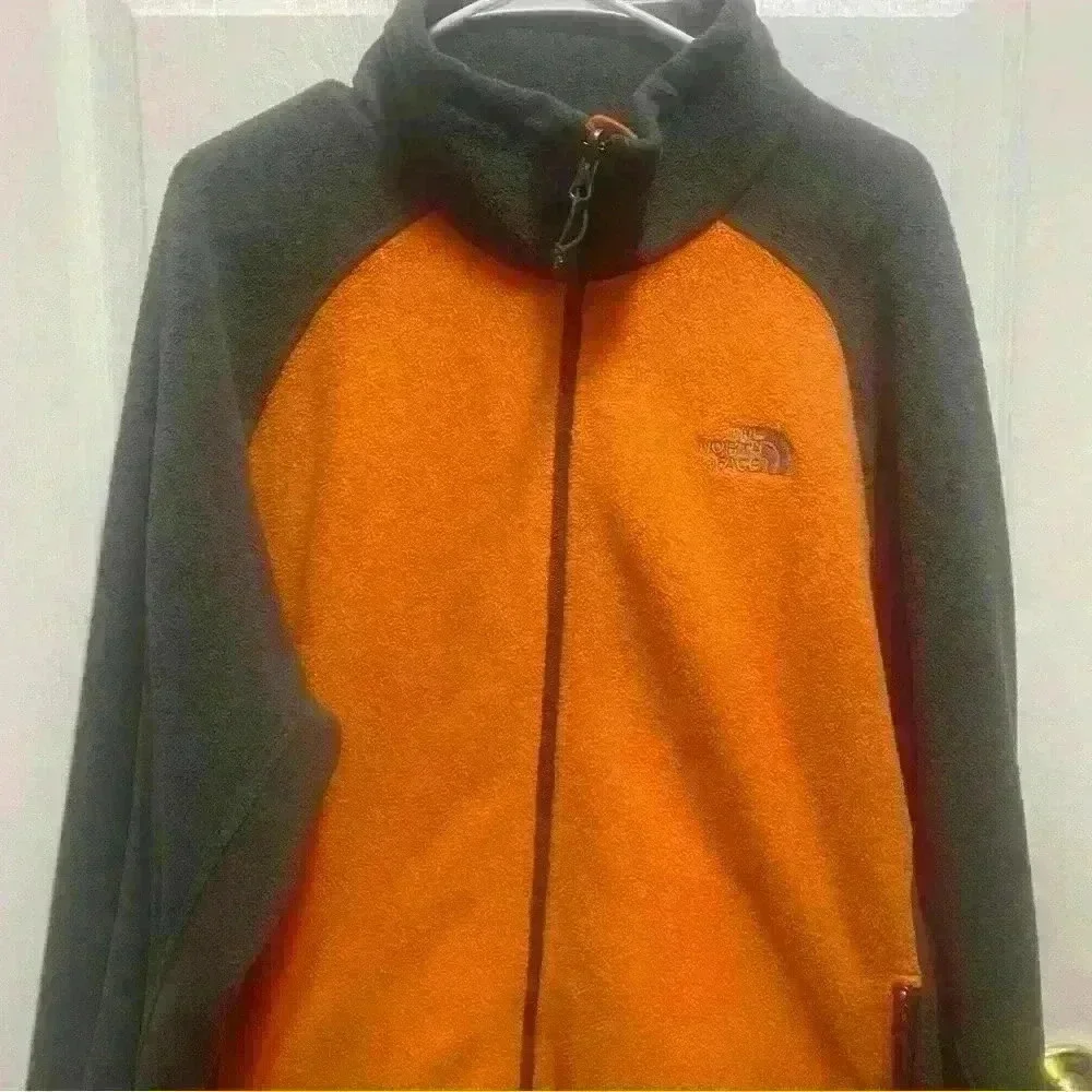The North Face - orange and gray fleece jacket